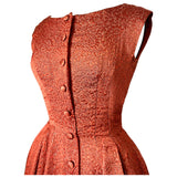 Burnt orange and gold brocade 1950s cocktail gown with button trimmed bodice