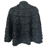 Bead and sequin embellished 1950s black wool capelet with interlaced ribbon