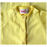 Unworn vintage 1960s yellow tricel knit crew neck cardigan